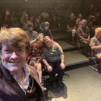 Jordan Allen takes a selfie with a audience at a full hours show
